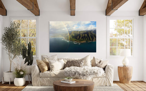 A piece of Napali Coast art created on a Kauai helicopter tour hangs in a living room.