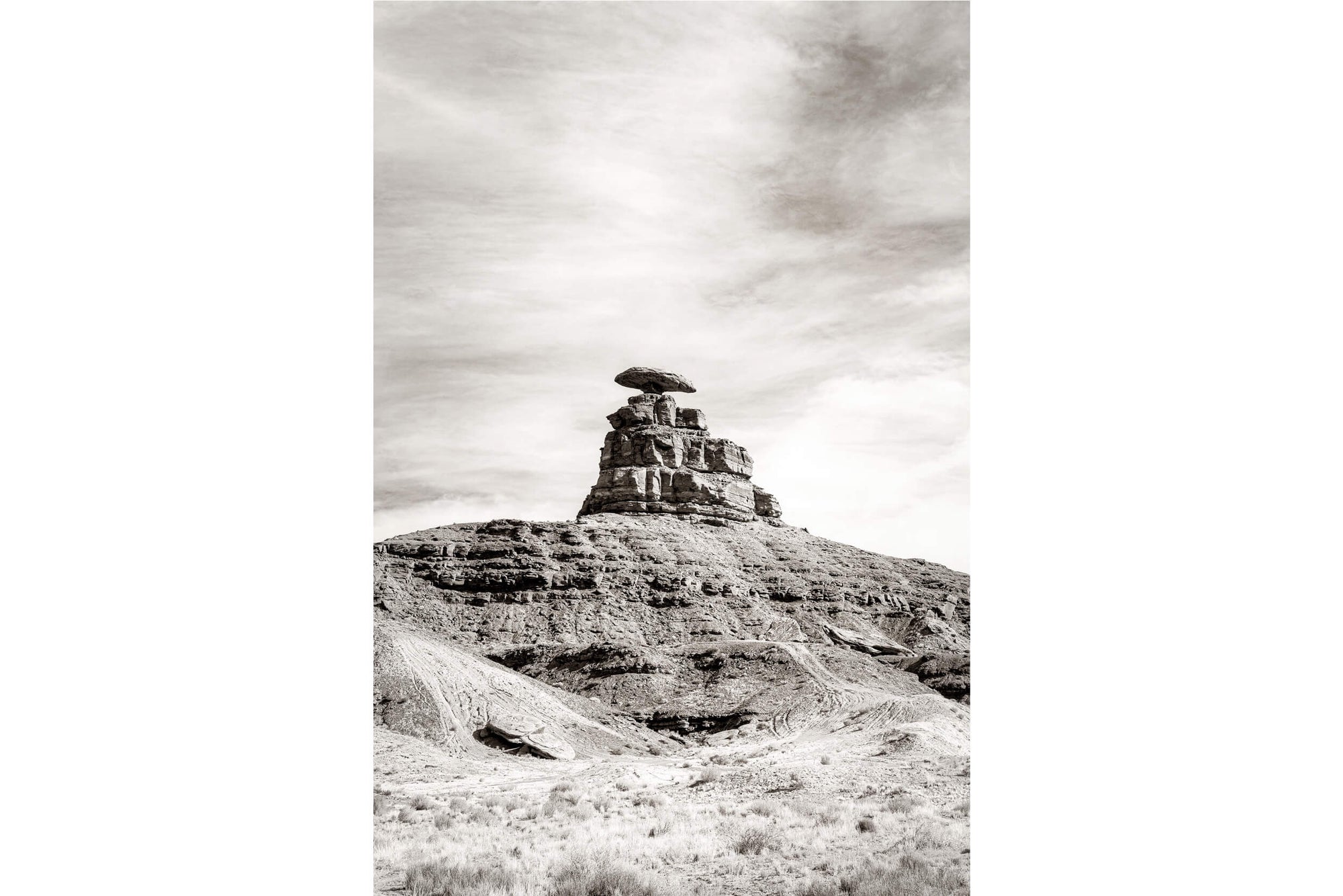 A black and white photo of Mexican Hat near Monument Valley in Utah.