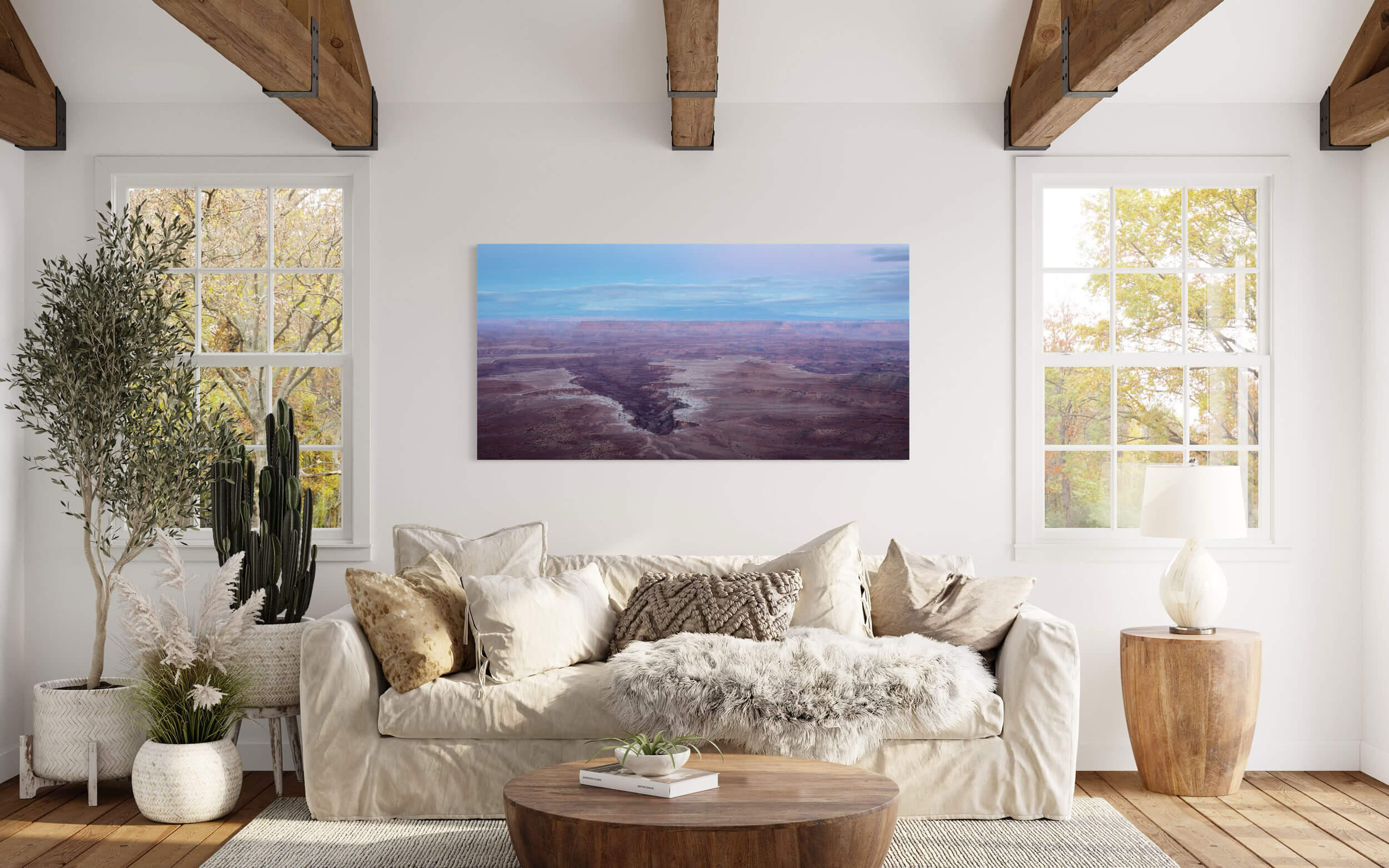 A piece of Moab art showing a Canyonlands National Park picture at sunset hangs in a living room.