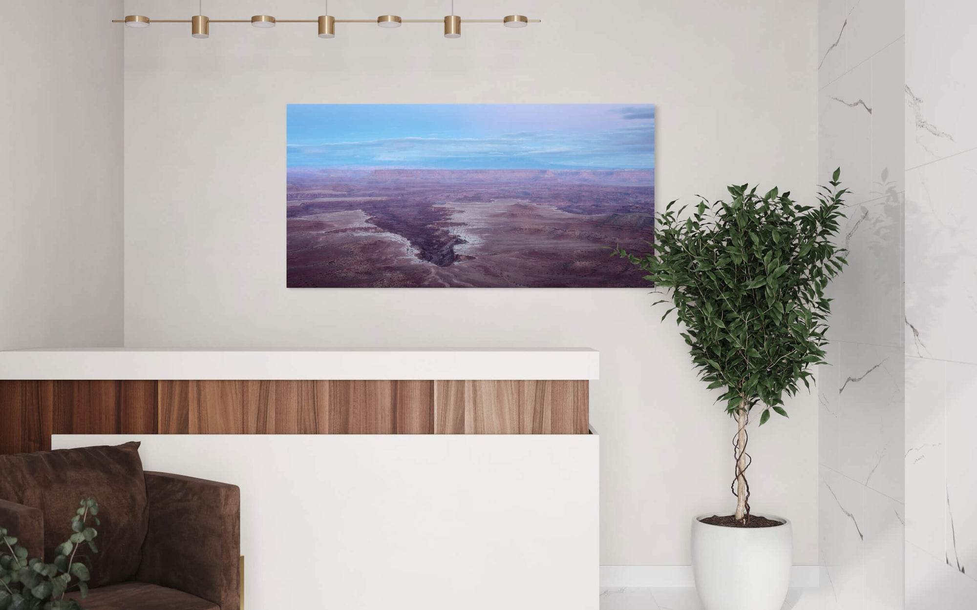 A piece of Moab art showing a Canyonlands National Park picture at sunset hangs in a living room.