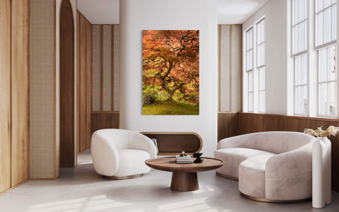 A piece of Japanese Garden art showing a maple tree hangs in a living room.