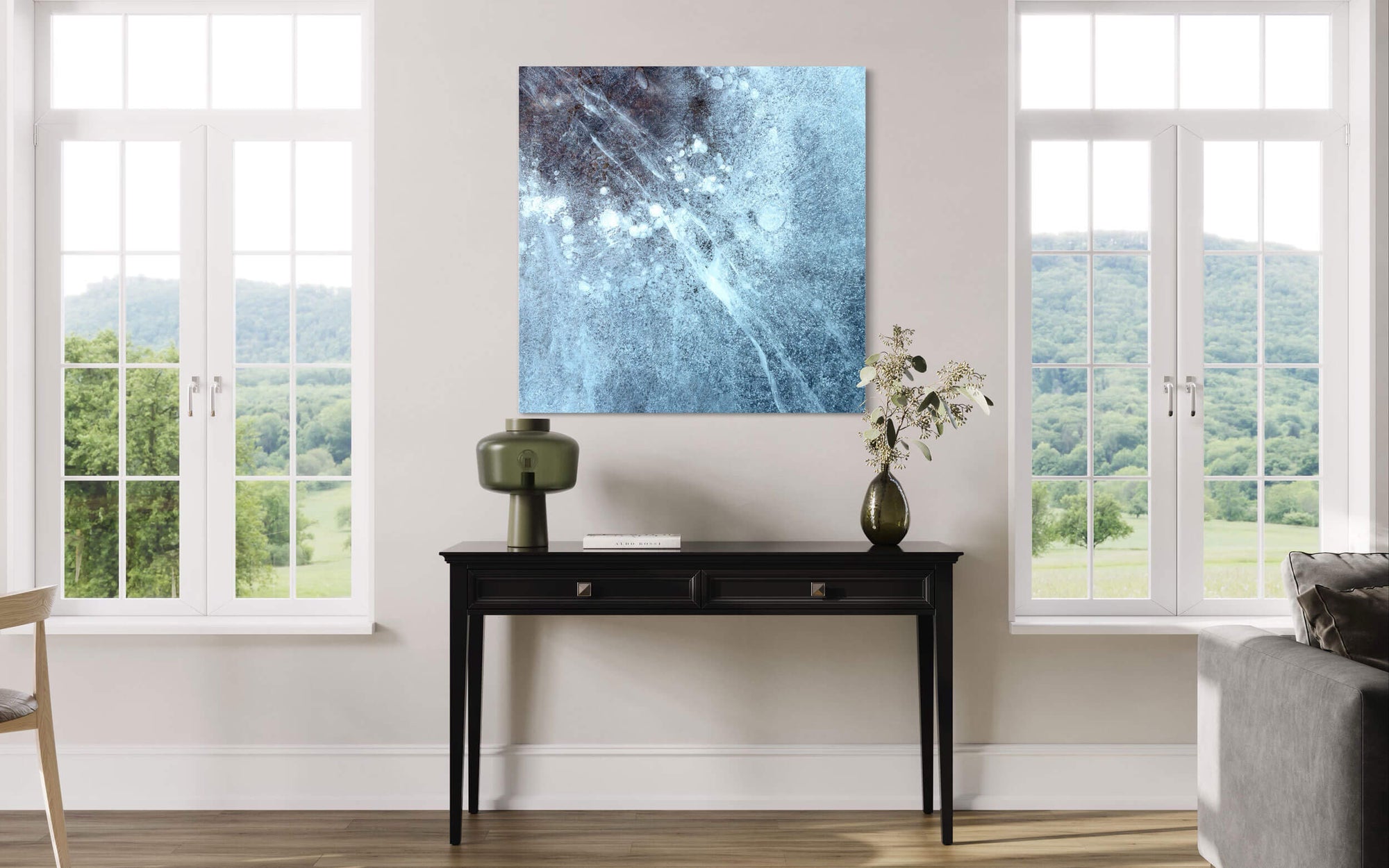 A piece of Rocky Mountain National Park art showing a Dream Lake picture hangs in a living room.