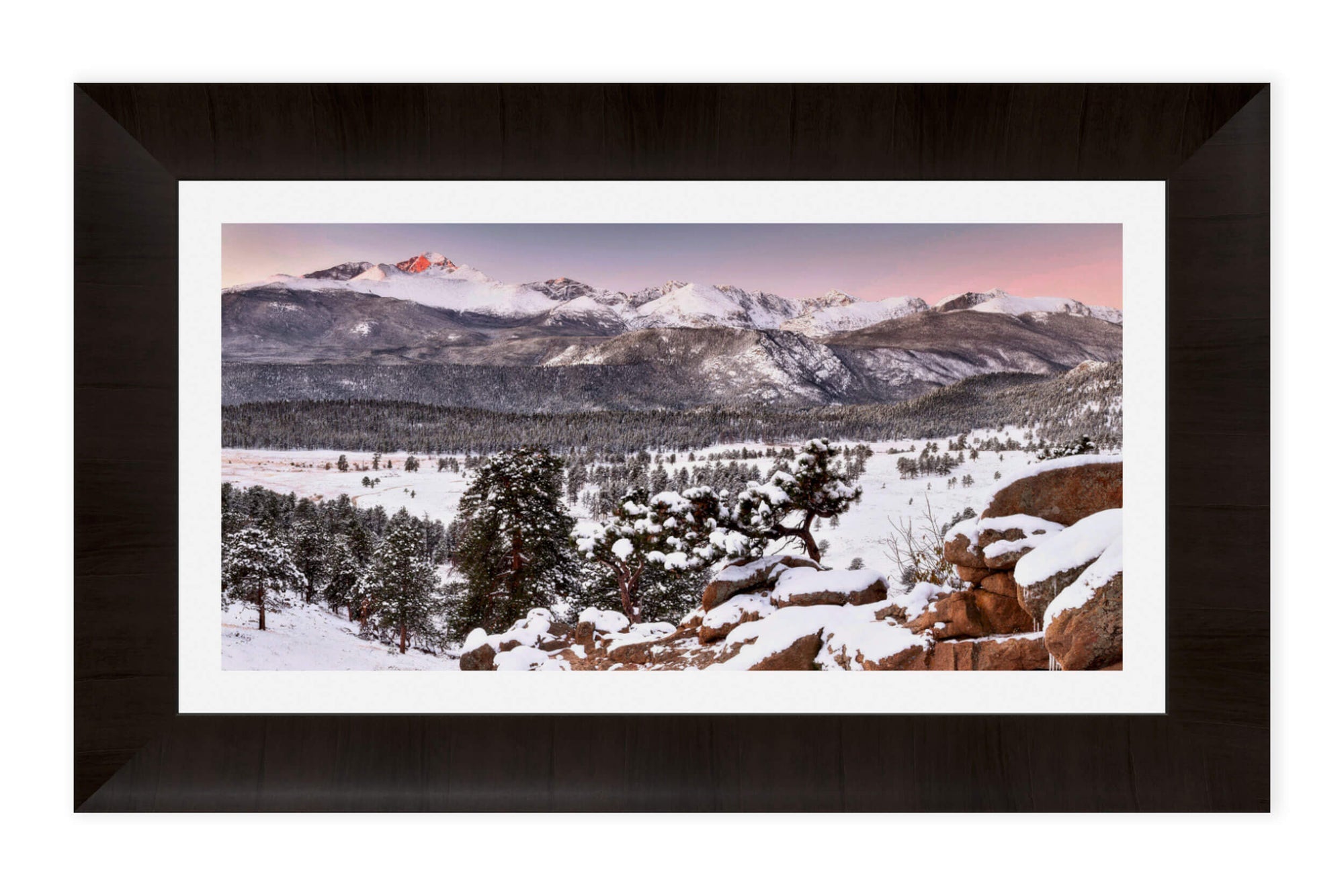 A piece of framed Rocky Mountain National Park art shows a sunrise near Estes Park, Colorado.