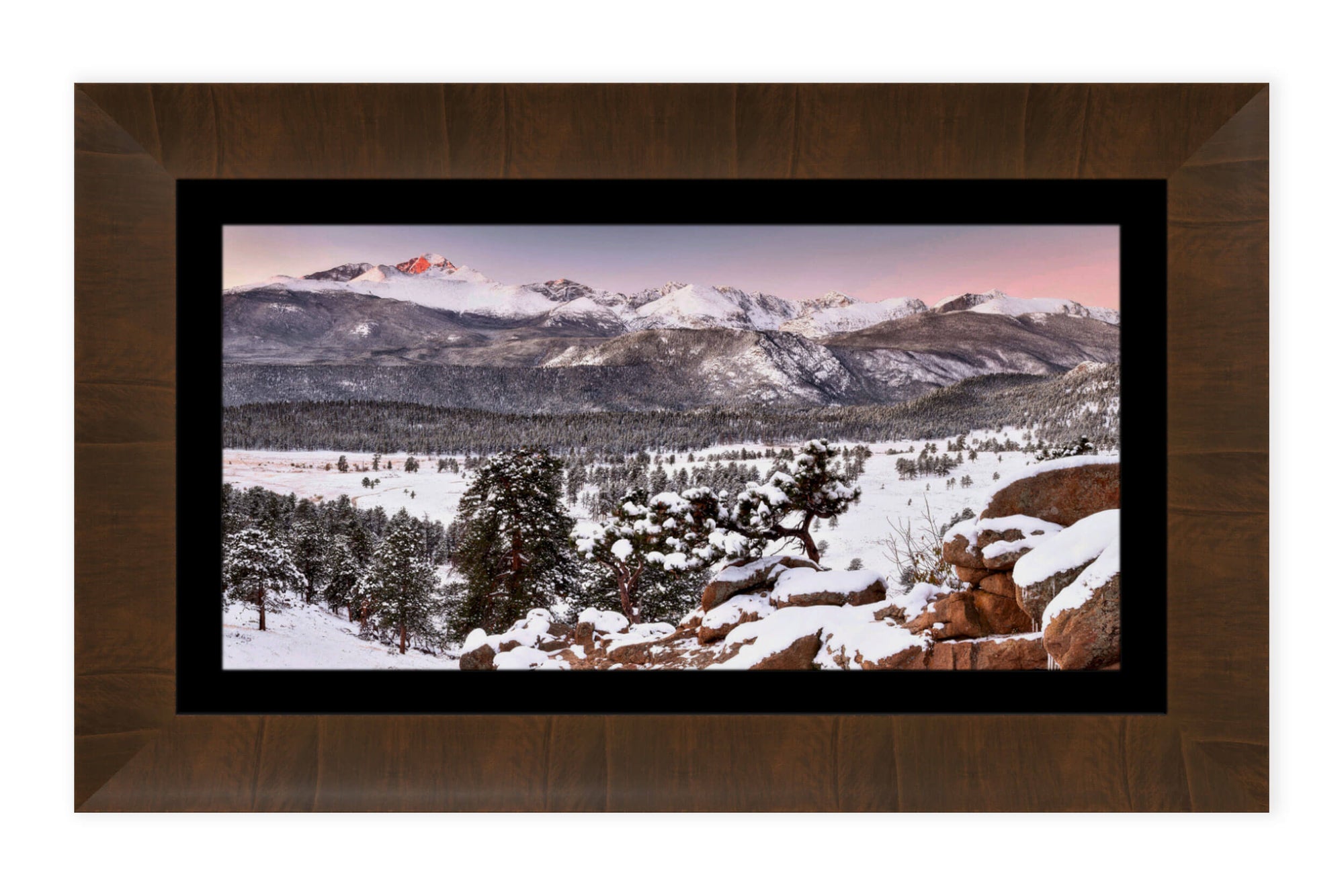 A piece of framed Rocky Mountain National Park art shows a sunrise near Estes Park, Colorado.