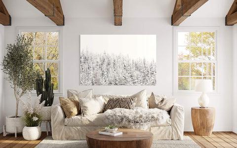 A piece of Steamboat Springs art showing snowy trees hangs in a living room.