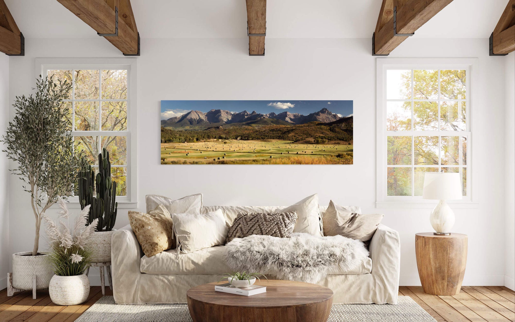 A piece of Telluride art showing the Ralph Lauren Ranch hangs in a living room.