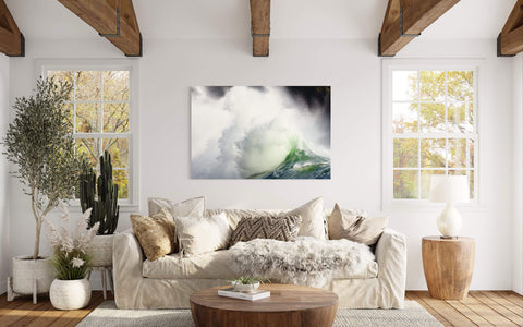 A piece of Washington art showing the waves at Cape Disappointment hangs in a living room.