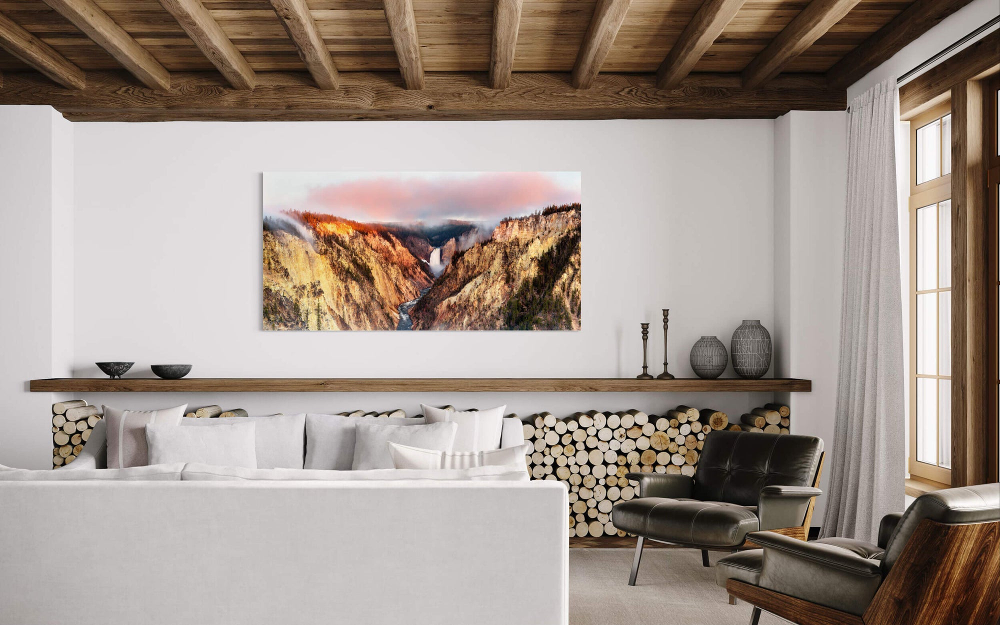A piece of Yellowstone art showing the view from Artist Point hangs in a living room.